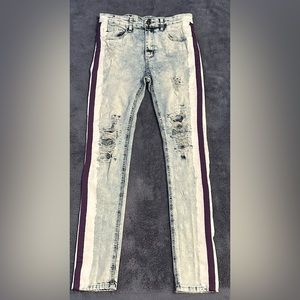 Distressed skinny jeans with purple stripe
